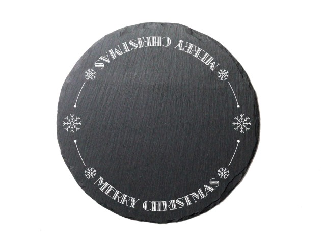 Round welsh slate cheeseboard laser engraved with the words Merry Christmas